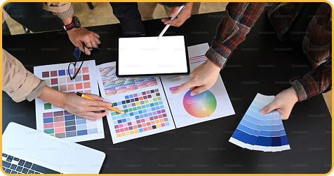 Design team reviewing color swatches on a desk.